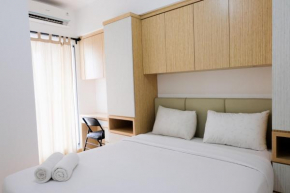 Comfy 2BR Apartment at M-Town Residence By Travelio